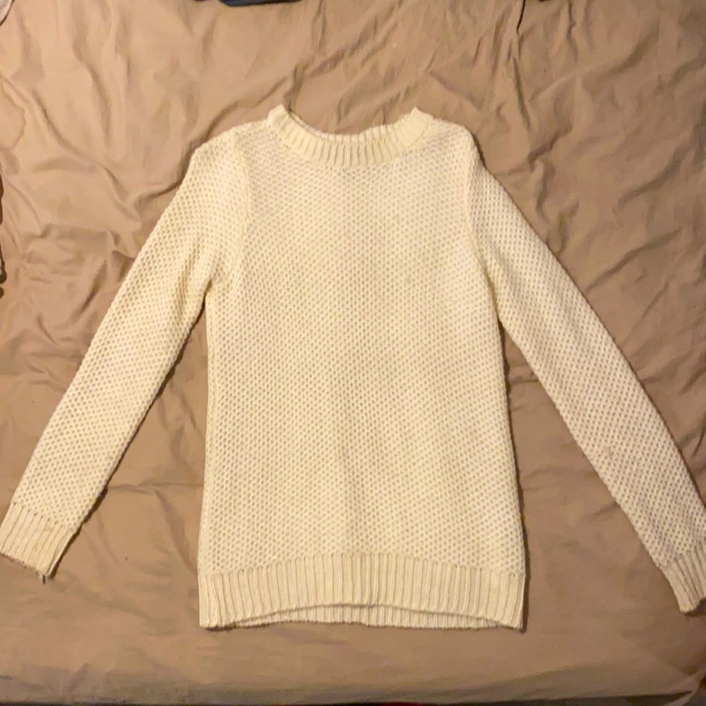 Worn once or twice. Knitted cream sweater.